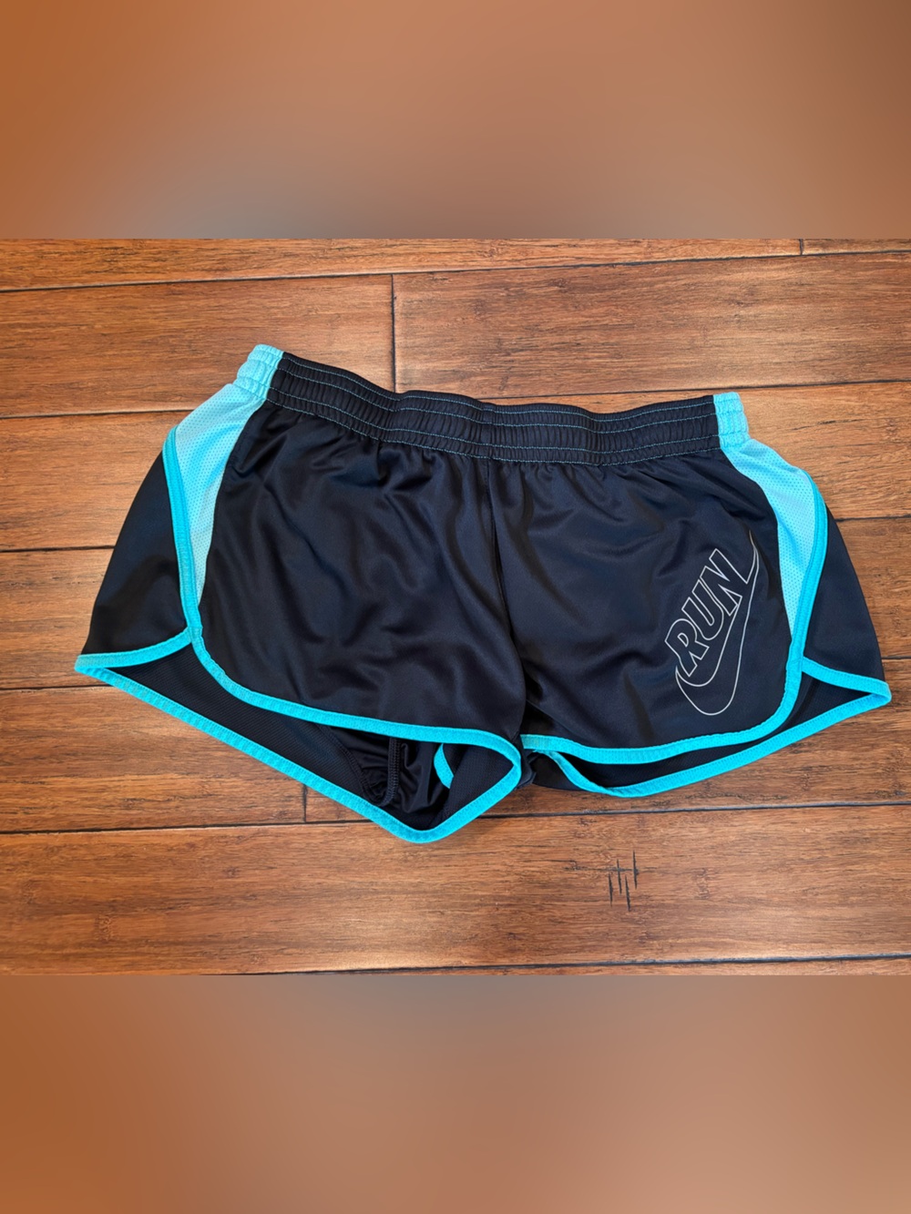 Nike Women’s Black Athletic Shorts with Teal Trim